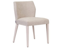 A white chair with a light colored upholstered back