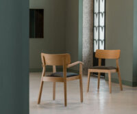 A couple of chairs sitting next to each other in a room