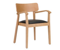 A wooden chair with a black seat cushion
